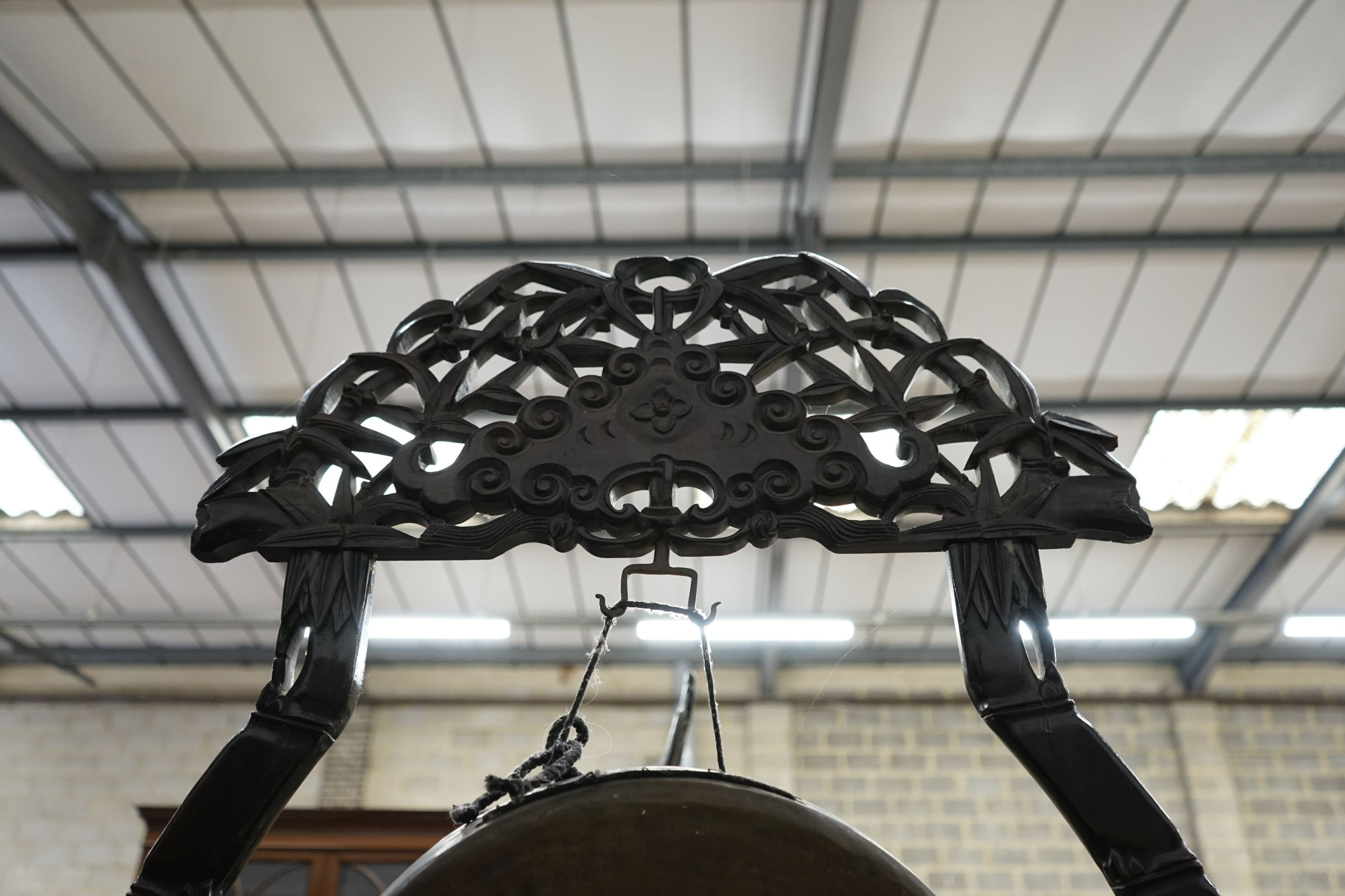 A Chinese carved hardwood gong on stand with beater, width 62cm, height 106cm